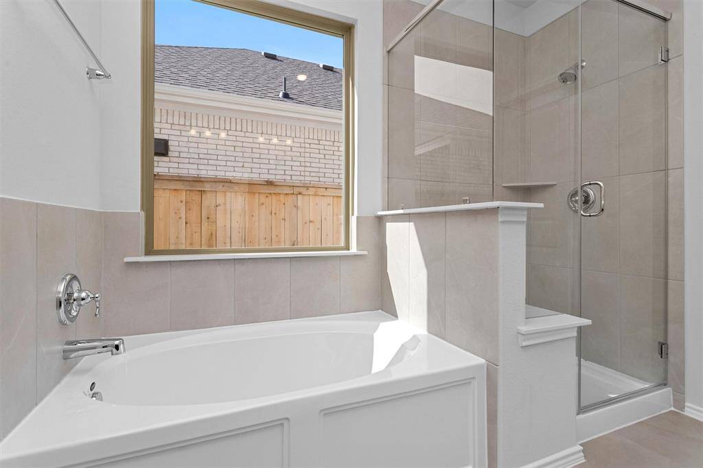 The Bathroom has upgraded tiles and bath tub surround with Acrylic Tile walls.