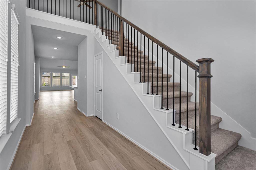 The two-story design provides ample space for living and entertaining.