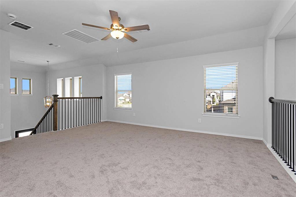 Upstairs, you'll find an expansive Game Room.