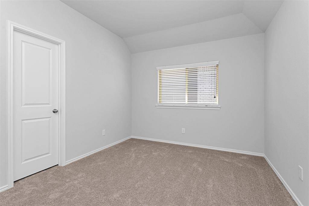 Bedroom #5 featuring a large window!