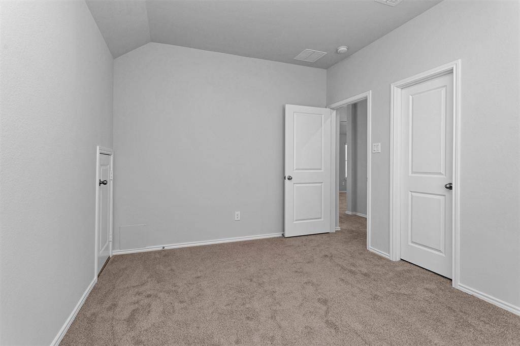 Bedroom #5 also features neutral paint.