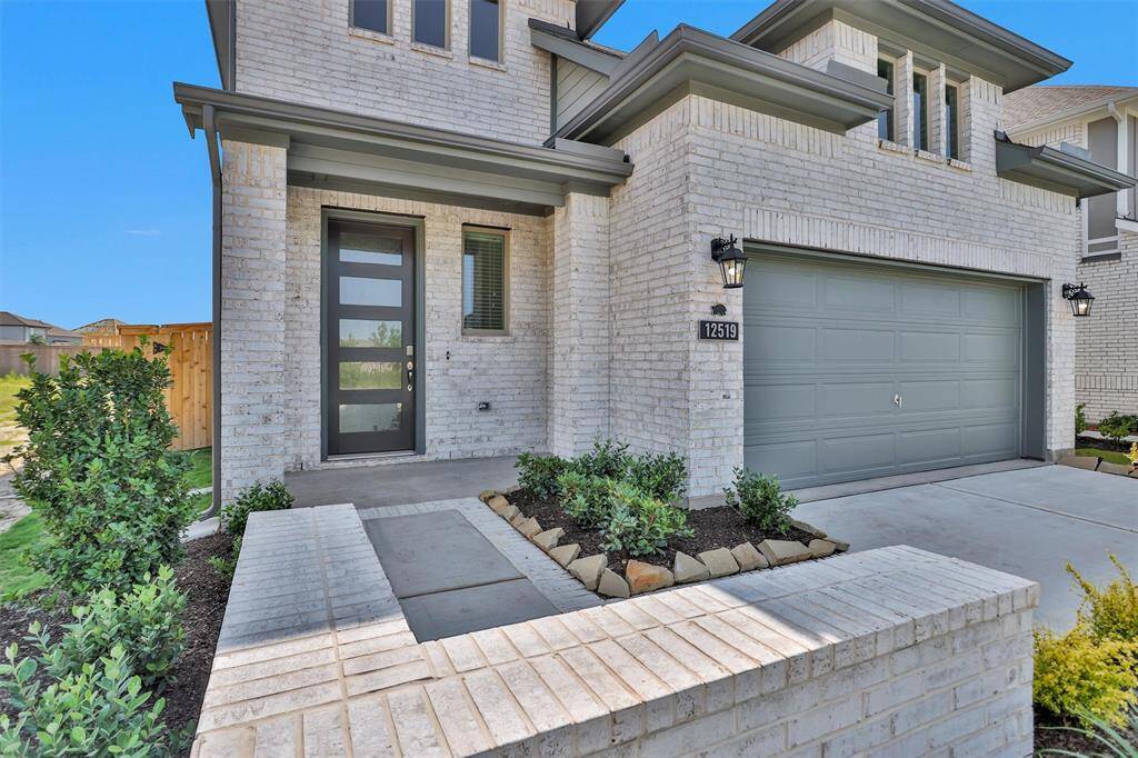 The exterior of the home also features coach lights!