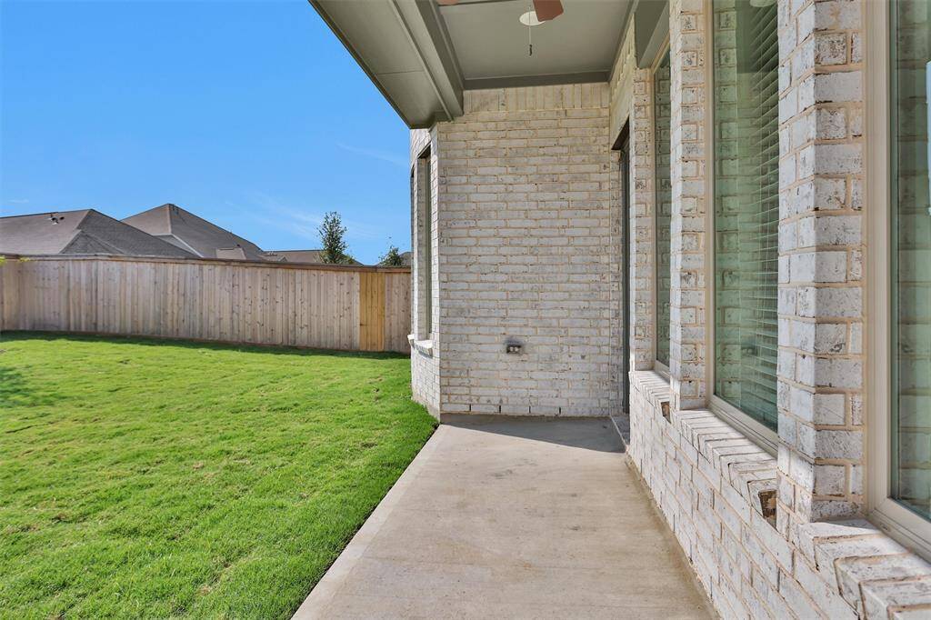 The covered Patio features a ceiling fan - perfect for warm Texas days.