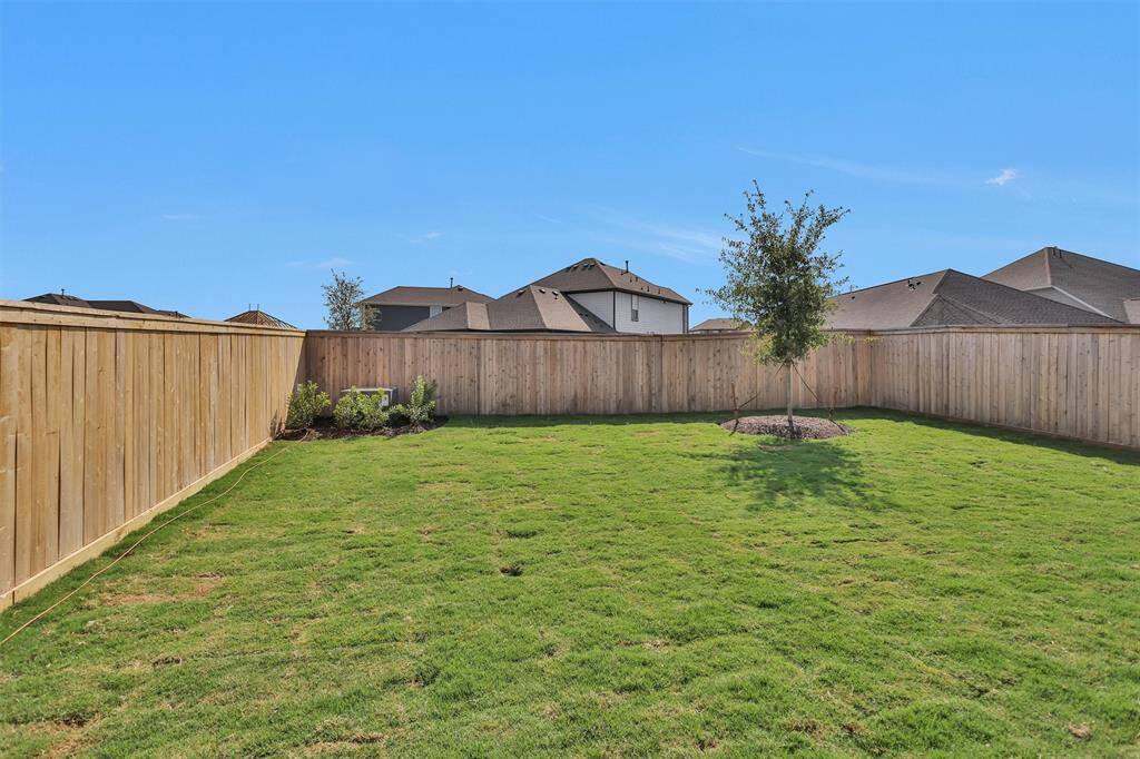 The spacious Backyard is perfect for enjoying your own outdoor space!