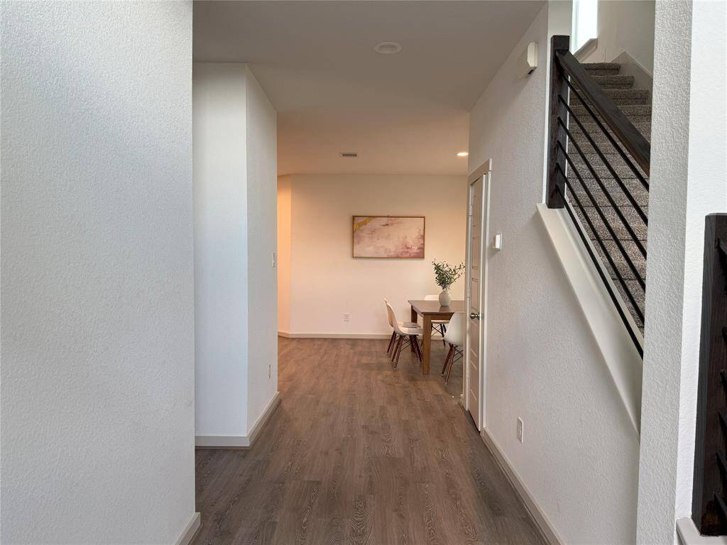 Spacious utility room adjacent to the garage, ideal for a mudroom setup.