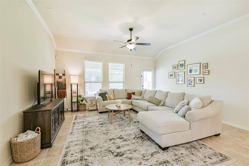 Large windows and glass back door allow in natural light from back yard.