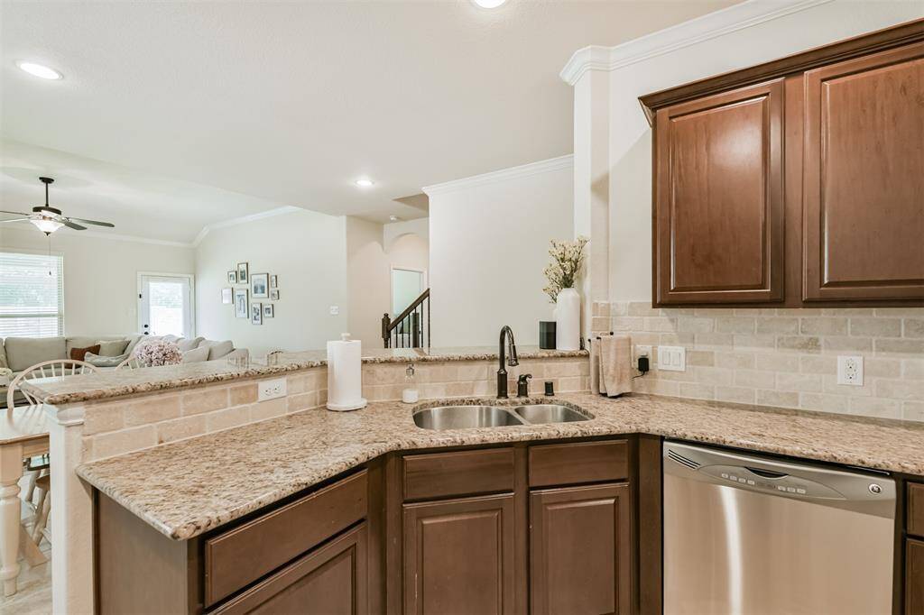 Open floor plan from kitchen into den.