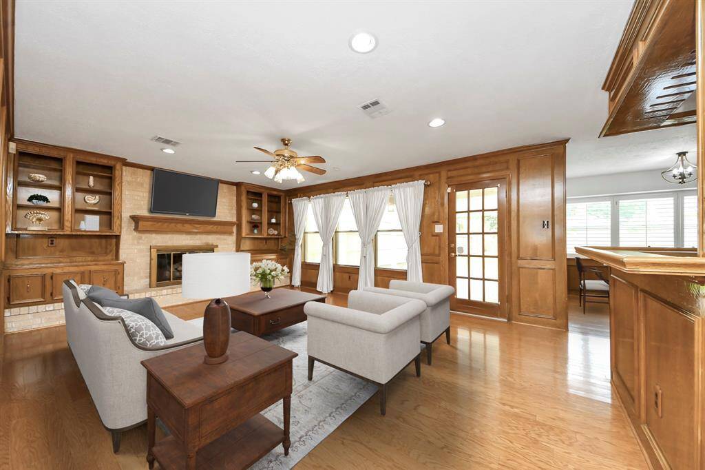 Open living area overlooking large private backyard. Virtually staged.