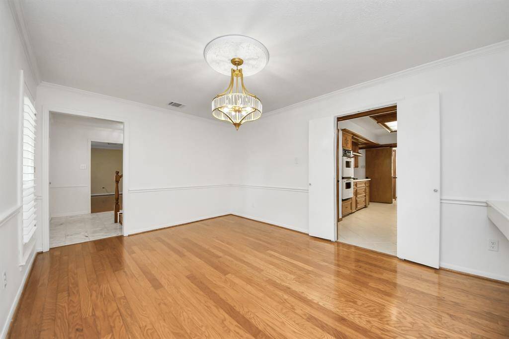 Formal Dining room with double doors to Kitchen and plantation shutters
