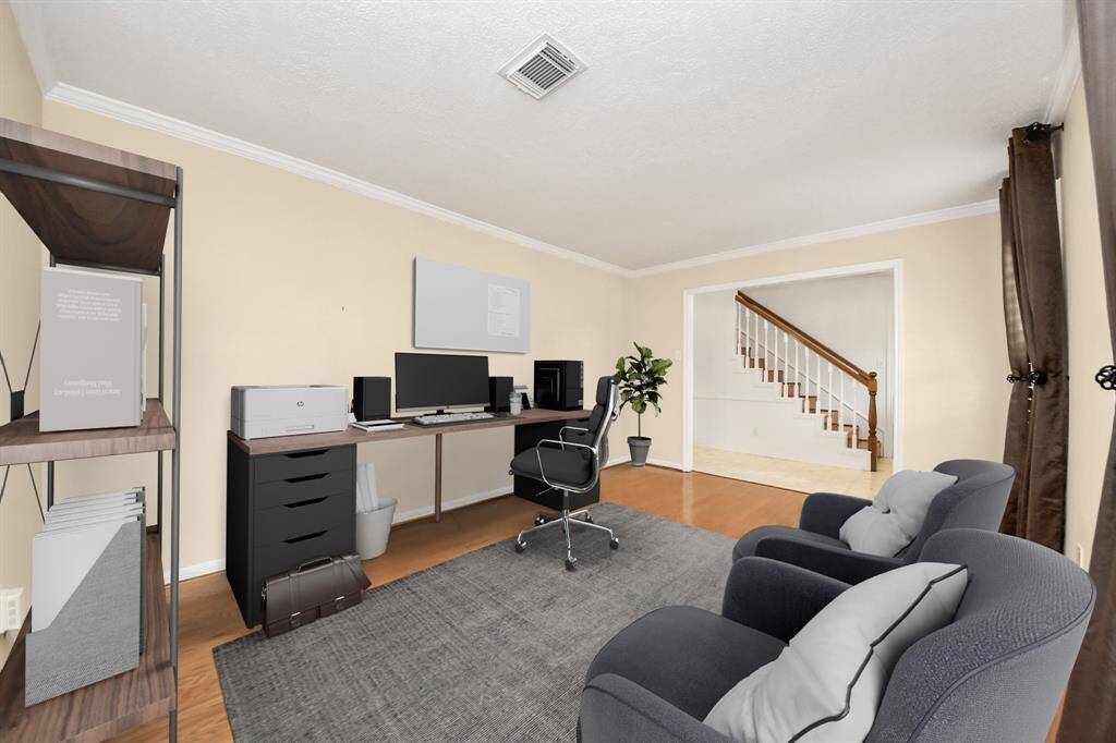Large flex room at the front of the home is a great space for an office/playroom/ extra sitting. Virtually staged