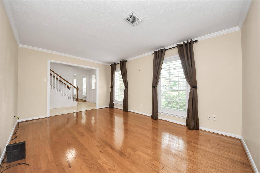 Large flex room at the front of the home is a great space for an office/playroom/ extra sitting with plantation shutters