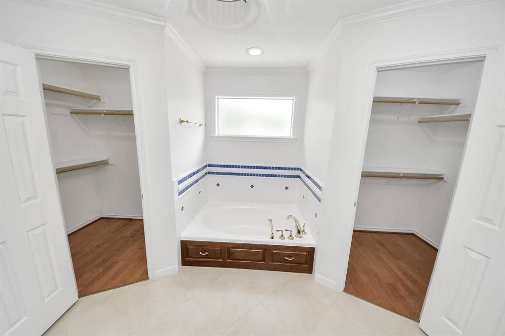 Remodeled Primary Bath with double walk-in closets and heated floors!