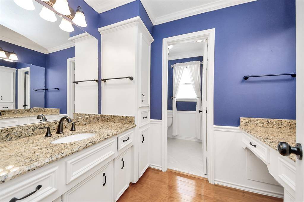 Large secondary bathroom, remodeled granite countertops, double sinks, new faucets and door pulls, and handles