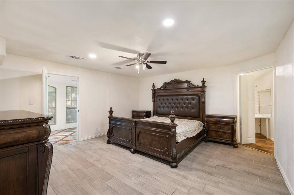 The luxurious primary suite is impressively sized and full of thoughtful touches—from its private kitchenette to the massive walk-in closet with custom shelving and endless hanging space. A true owner’s escape.