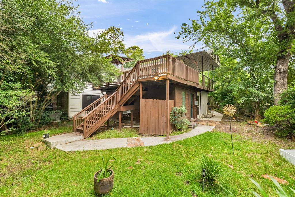 The spacious backyard offers a blank canvas for your outdoor vision—plenty of room to play, garden, or unwind. The second-story balcony gives a bird’s eye view of your private retreat, with no back neighbors in sight.