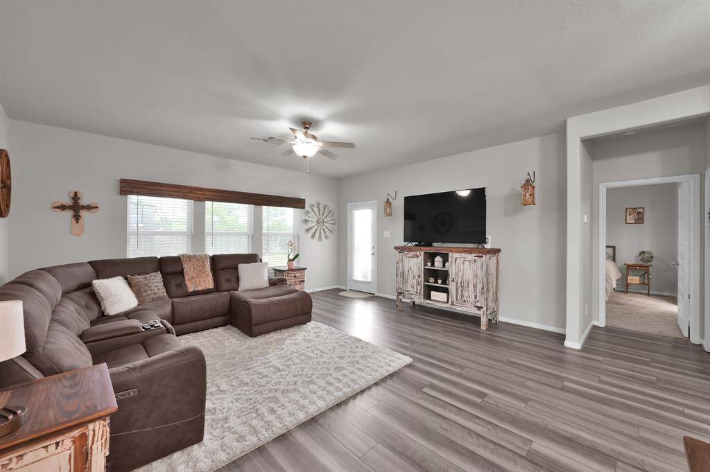 Living room with primary bedroom to right