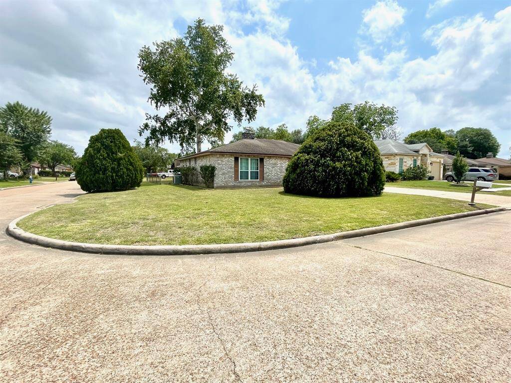 Welcome home to 13011 Harwin Dr. on a huge corner lot!