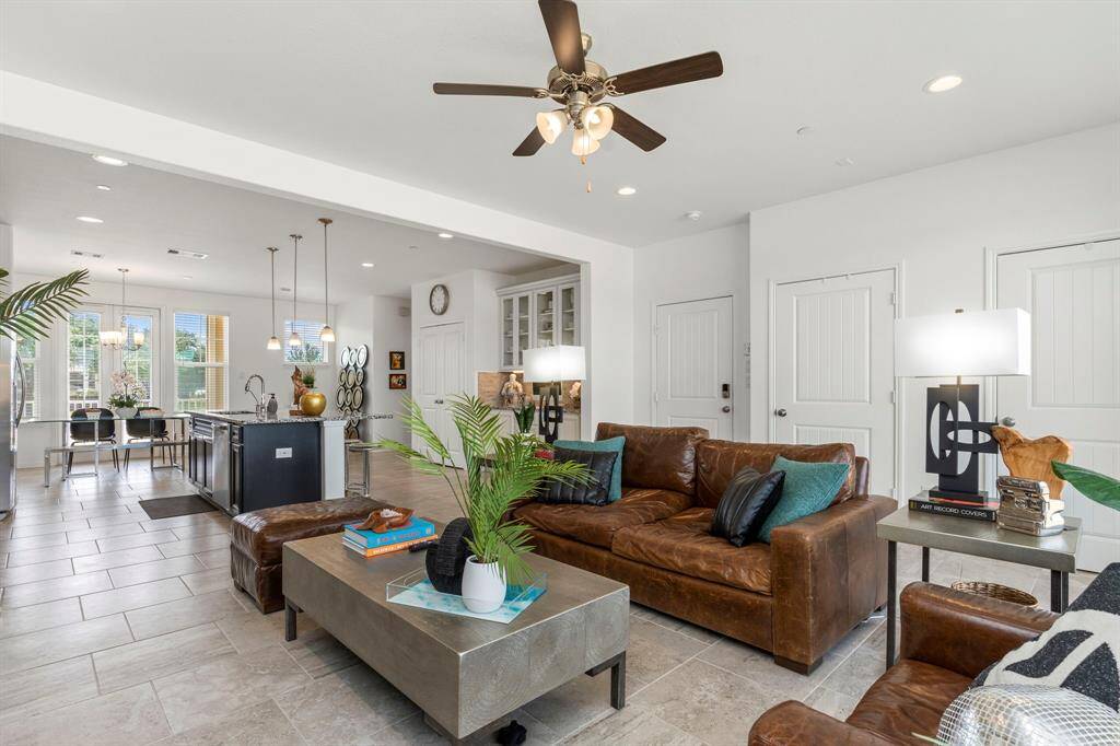 A true centerpiece! This oversized granite island is the heart of the home—perfect for morning coffee, conversation, or meal prep under warm pendant lighting.  Deep undermount stainless steel sink, swan pull out kitchen faucet and more!
