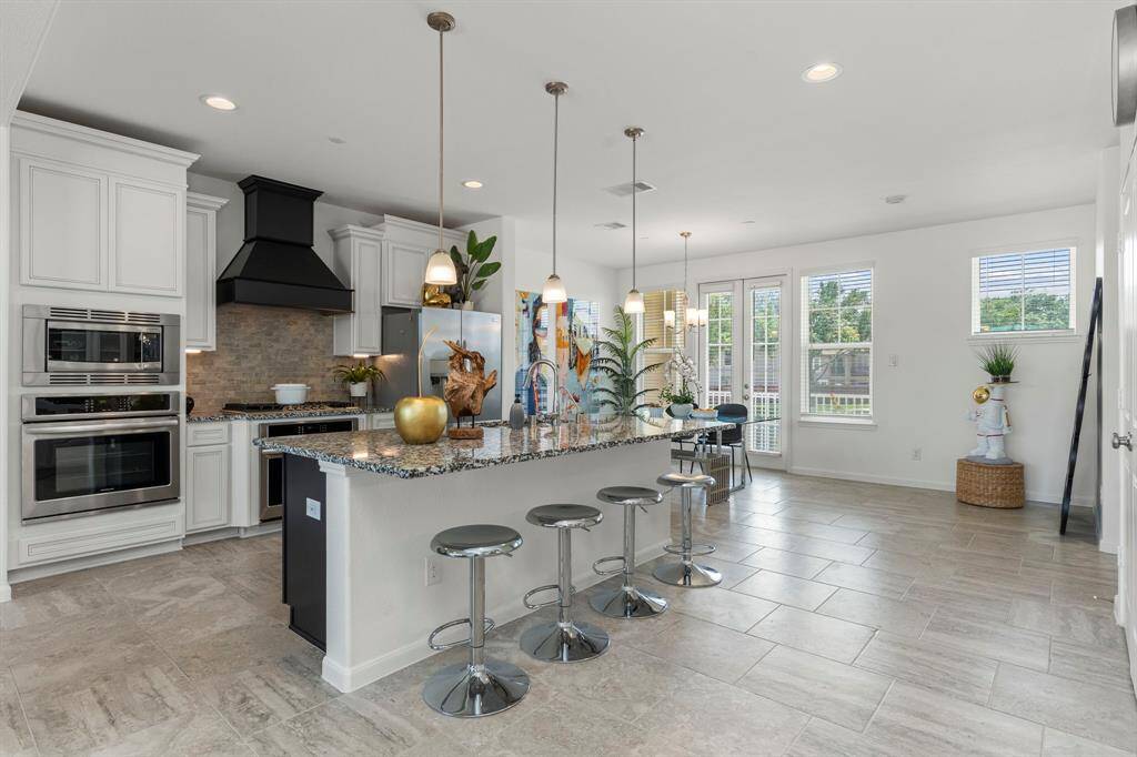 Open the French doors to bring the inside to the outside or enjoy that evening wine looking out to the community!