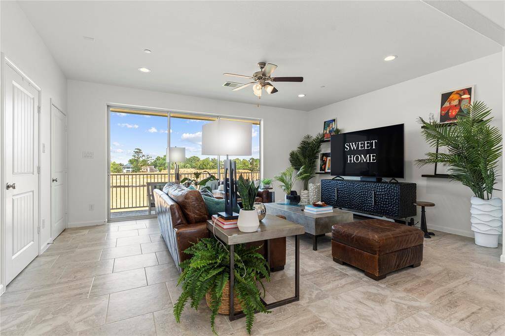 From the comfort of your couch, enjoy uninterrupted views through expansive sliding glass doors that lead to the private covered balcony. Whether you're enjoying a quiet night in or hosting guests, this indoor-outdoor connection brings the best of both worlds together in perfect harmony.