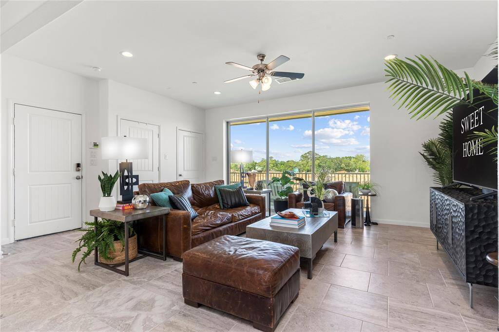 Imagine mornings with coffee in hand or peaceful evenings under the sky on this generously sized balcony. Overlooking your backyard and distant water views, the space easily accommodates cozy seating and décor—making it your personal outdoor escape.