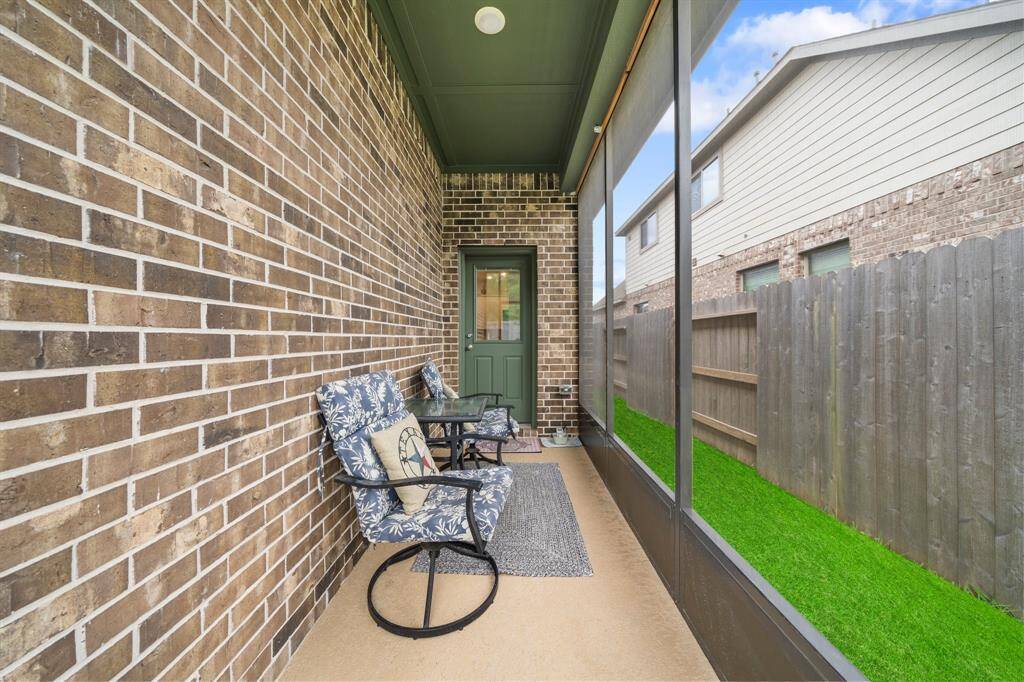 Screened in porch area with the entrance off the dining room.