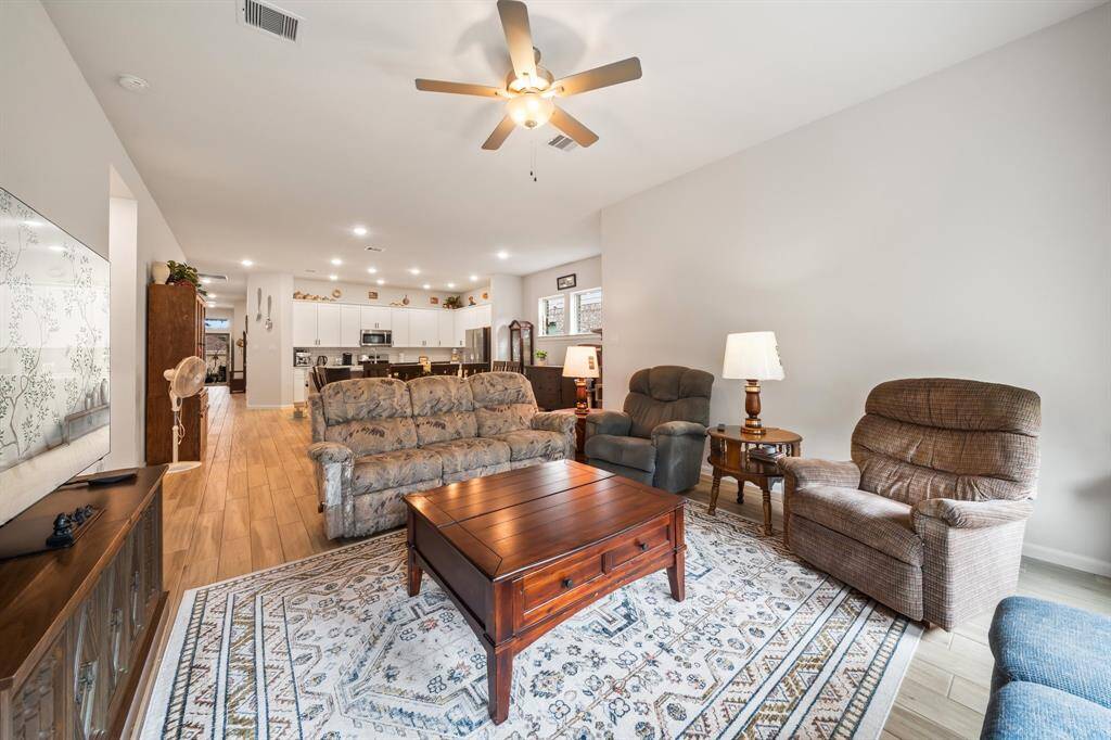 Open concept with family room, dining and kitchen.