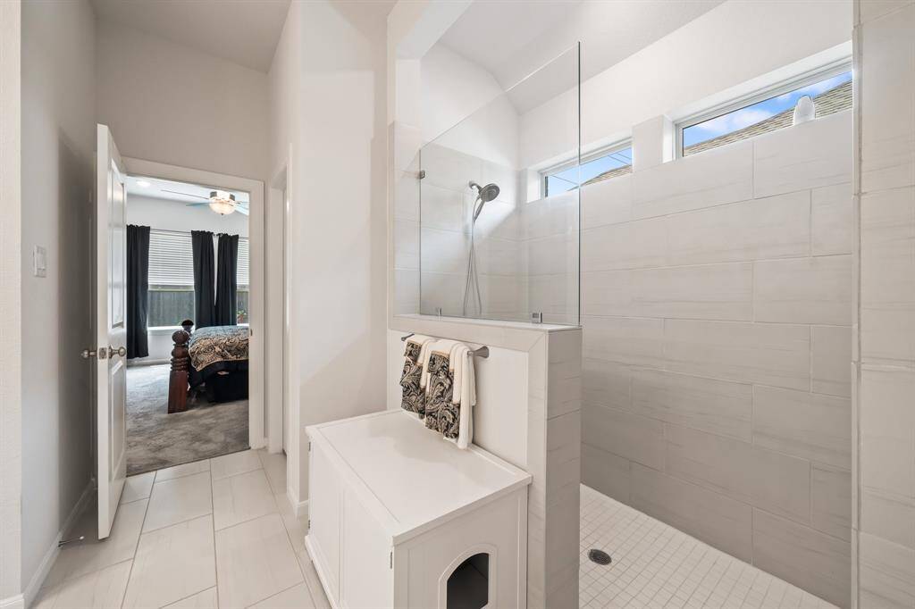 Primary bathroom has an oversized walk-in super shower,