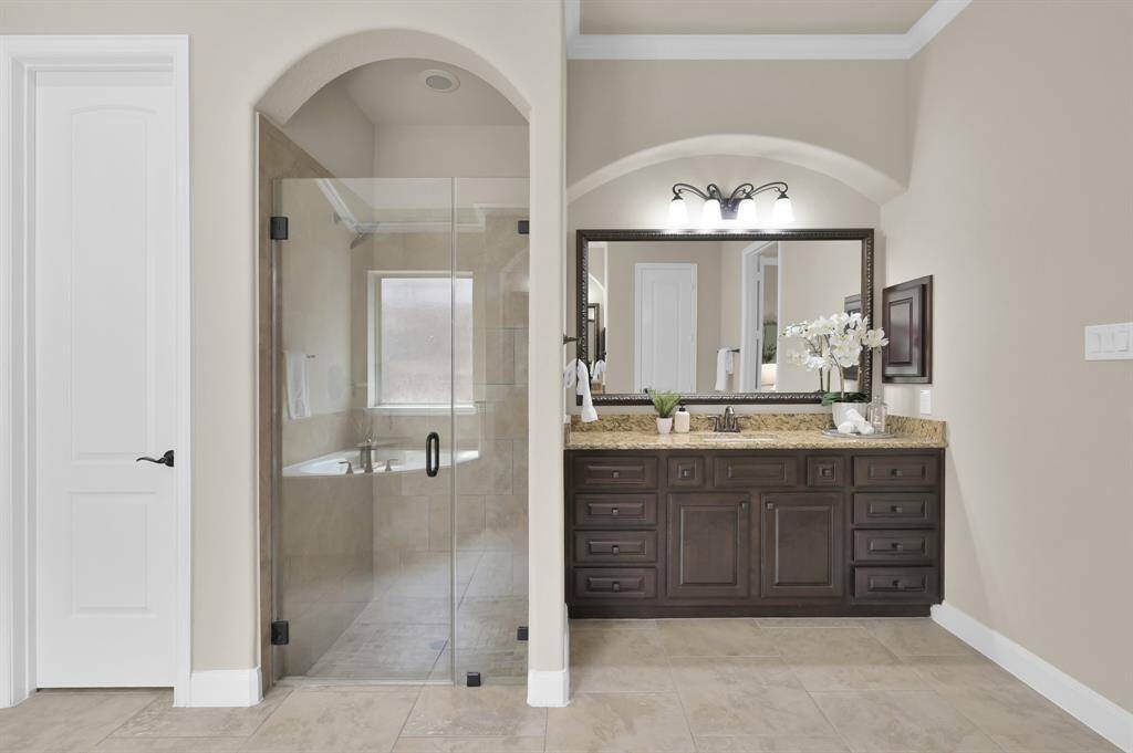 Large walk-in shower of the primary suite/