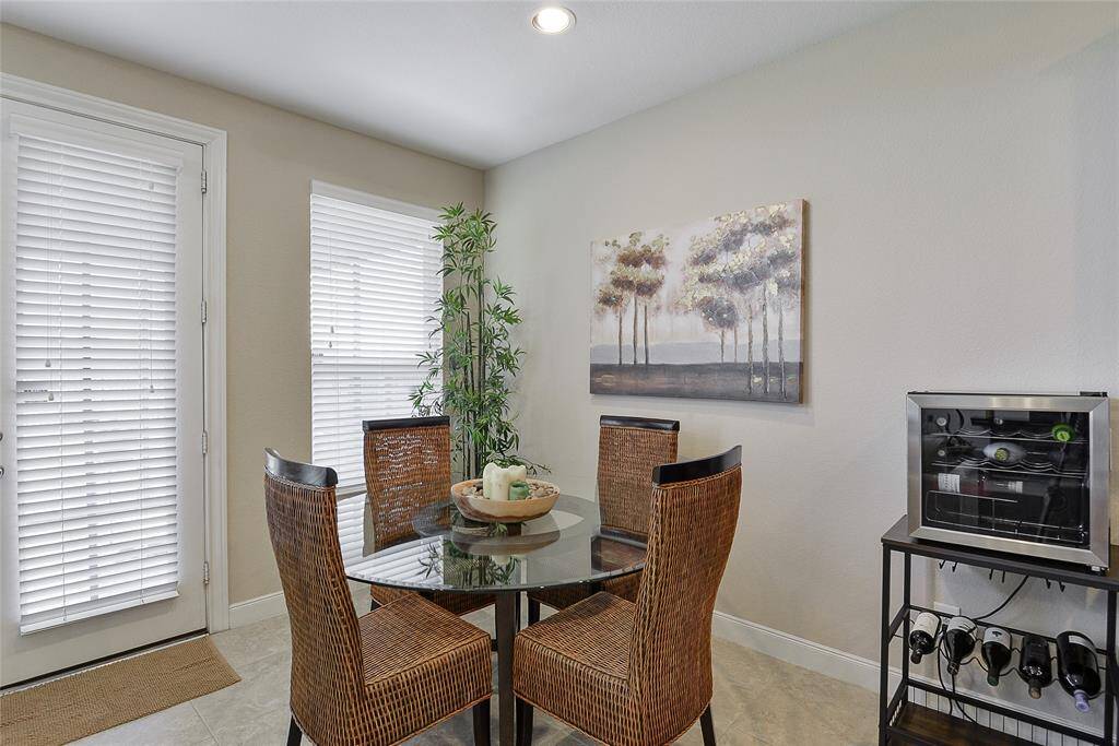 The breakfast nook provides a cozy and convenient dining option, offering a relaxed alternative to the bar seating or formal dining room—perfect for everyday meals.