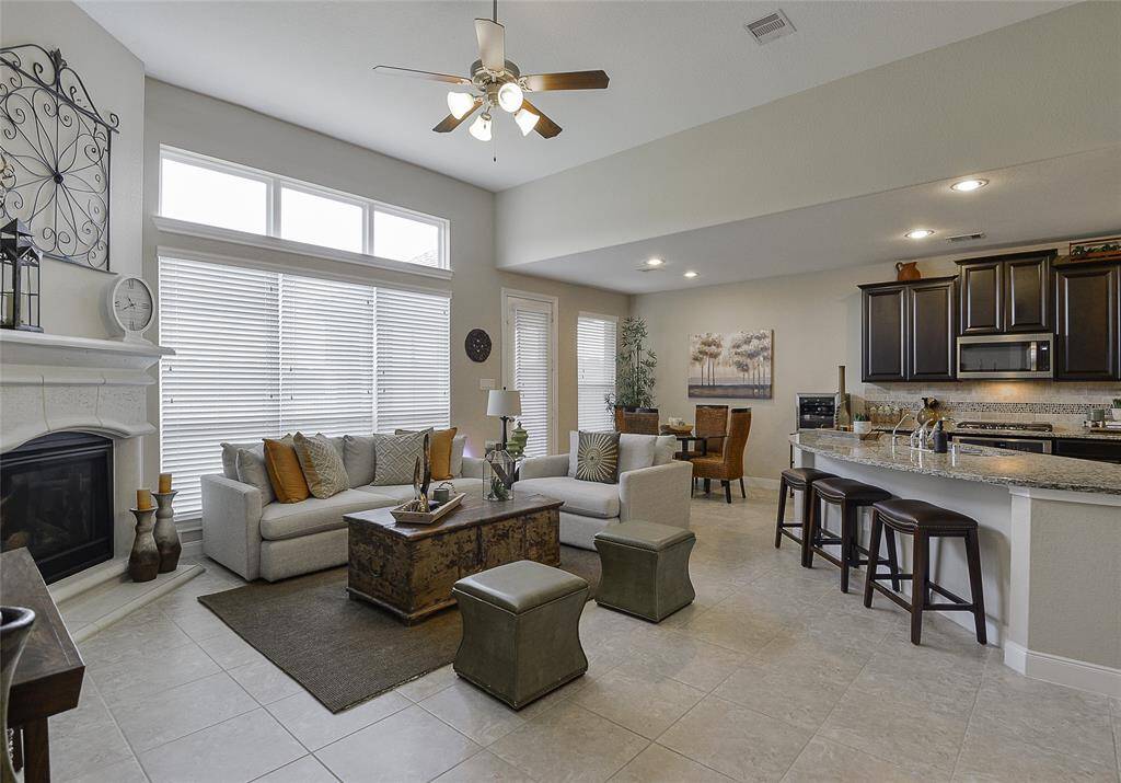 The chef’s kitchen is thoughtfully designed with a clear view into the living room, allowing seamless interaction while entertaining guests or enjoying family time.