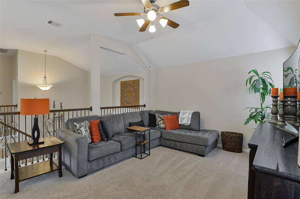 The game room provides versatile space, ideal for a media setup or game area, with an open layout perfect for entertaining a large group of family and friends.