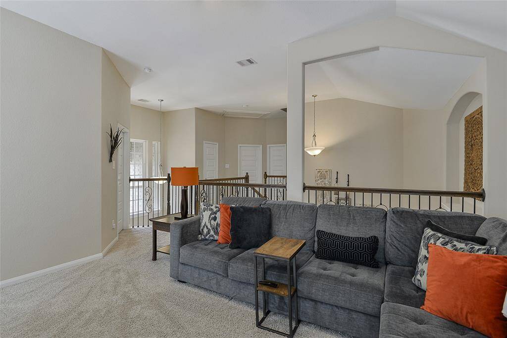 The game room provides versatile space, ideal for a media setup or game area, with an open layout perfect for entertaining a large group of family and friends.