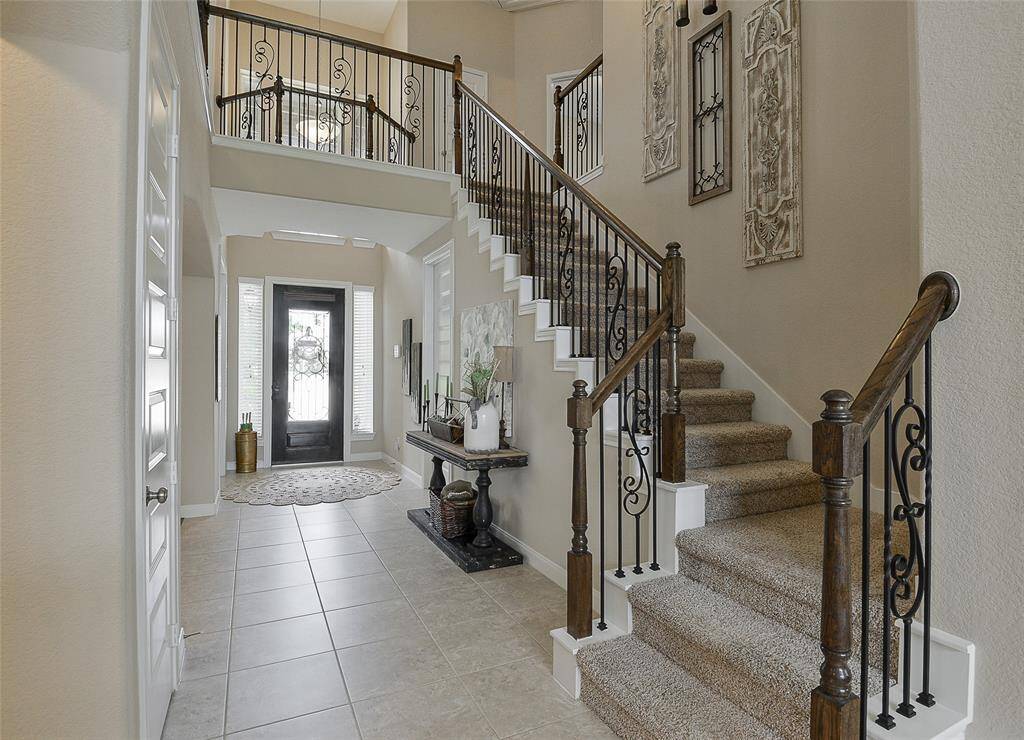Amazing semi u shaped stair case - Crafted with Wrought Iron Spindles and hard Wood.