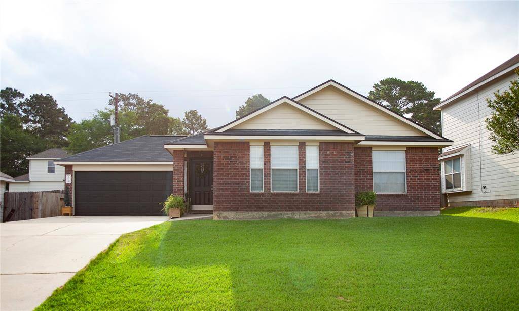 Welcome to 13740 Bighorn Trail, Willis, TX 77378—a charming brick home nestled in the highly sought-after Caddo Woods neighborhood.