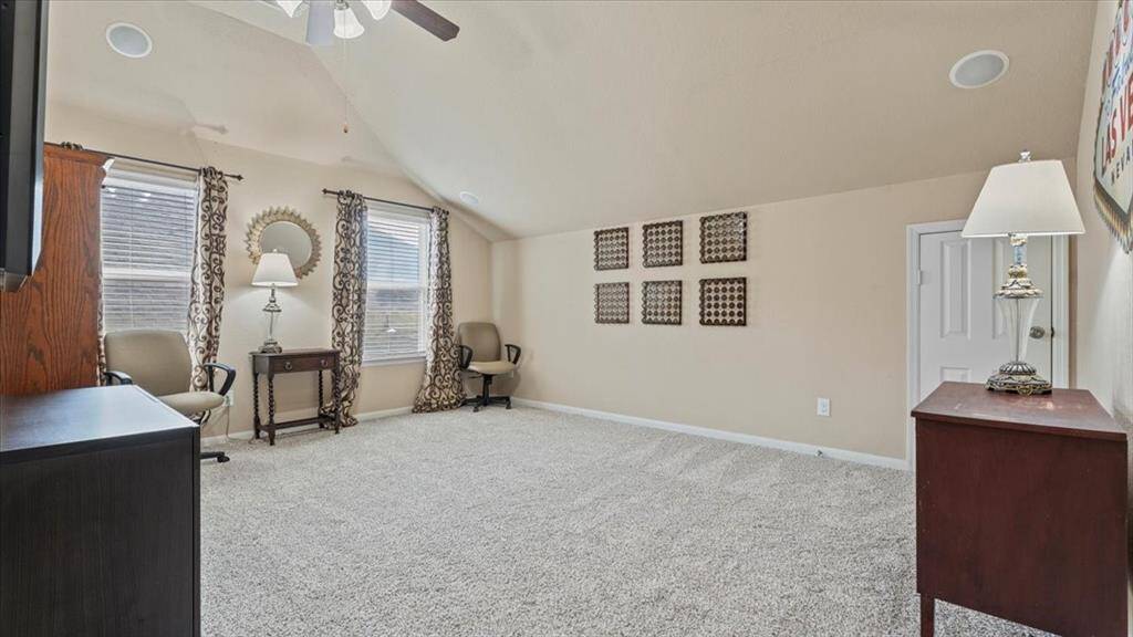 Gameroom with raised ceiling and surround sound