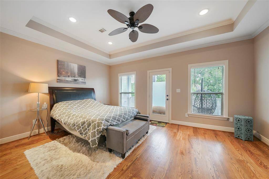 Master Bedroom- Features a tray ceiling, recessed lighting, a ceiling fan and direct access to the 2nd floor balcony