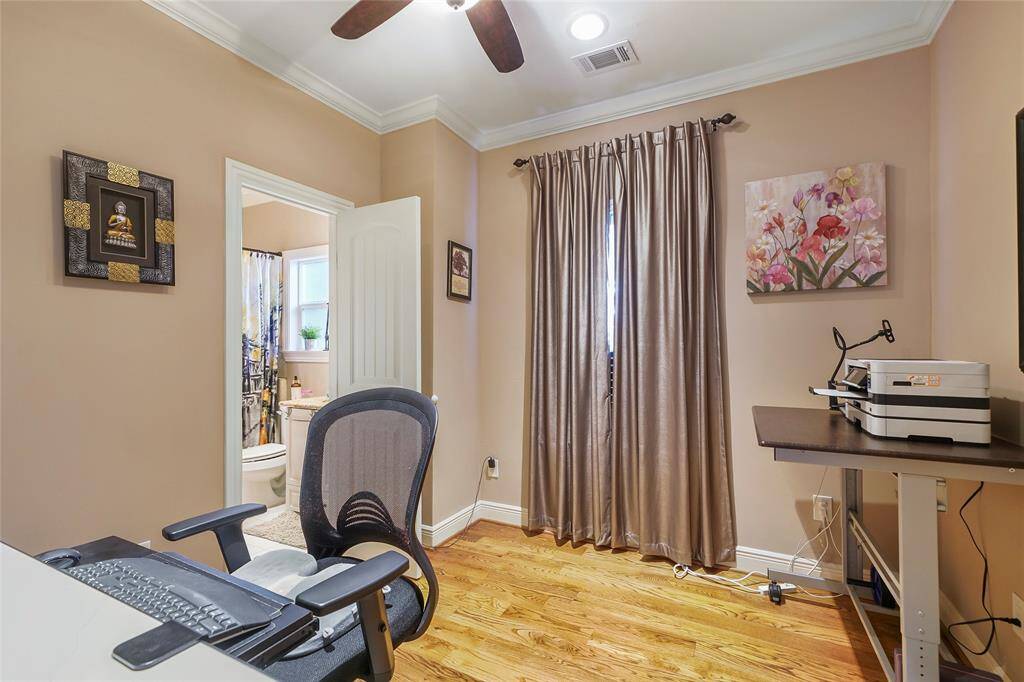 Secondary Bedroom- Located on the 2nd floor the secondary bedroom has direct access to the shared secondary bathroom, crown molding, recessed lighting, a ceiling fan with light and wood flooring