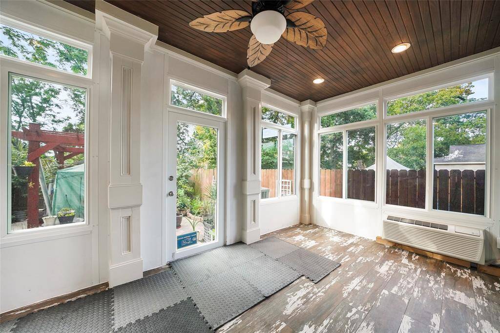 Sunroom- Just off the kitchen this sunroom offers plenty of windows allowing natural light to fill this room, recessed lighting, a ceiling fan with light, a wood detail roof and direct access to the backyard