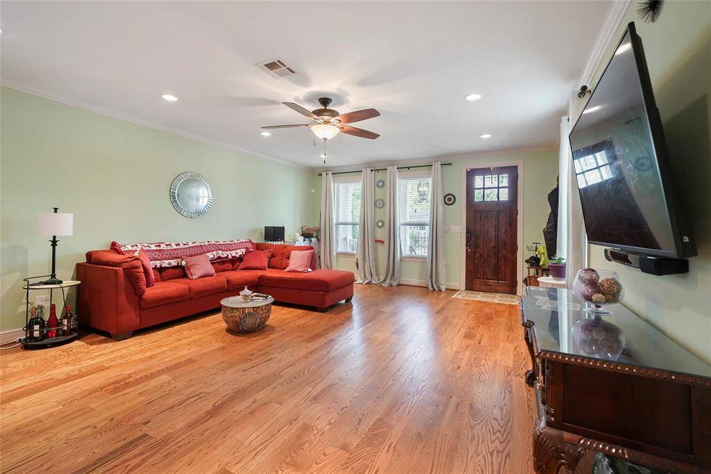 Living Room - View 2 - Features recessed lighting and a ceiling fan with lights