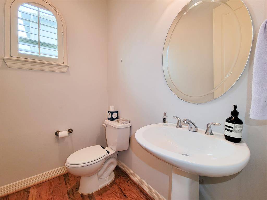 Second floor powder room with pedestal sink.