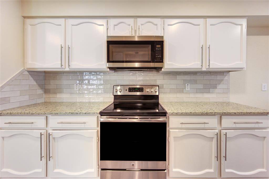 All new appliances, cabinet pulls, granite, and backsplash!