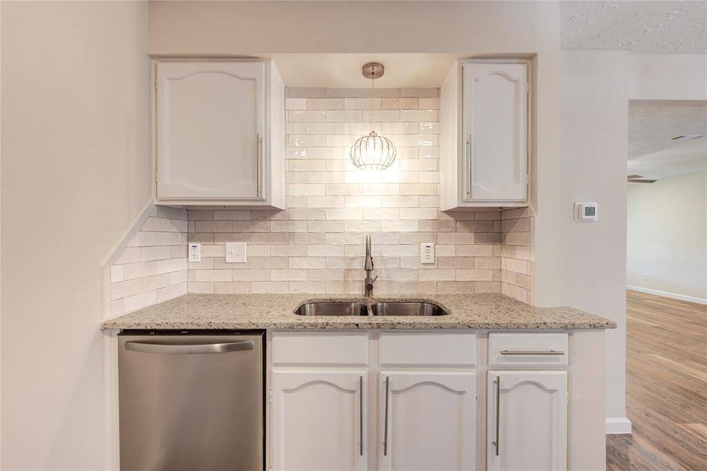 New sink and faucet and a beautiful backsplash