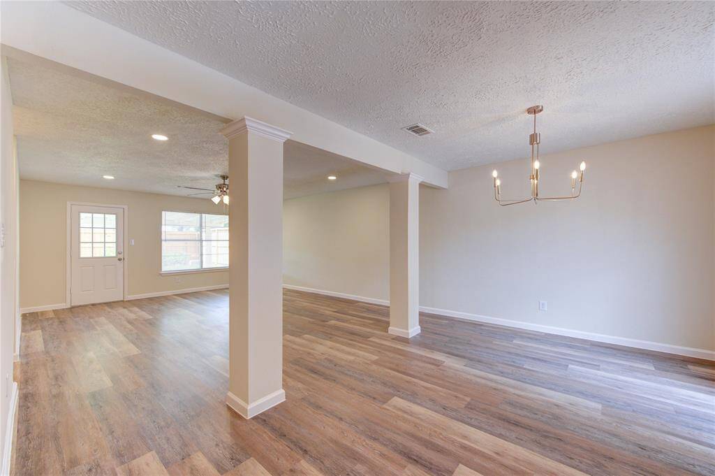 Large family and formal dining space with all new flooring, fresh paint, new light fixtures.