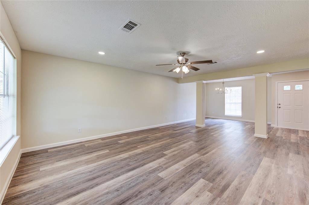 Family room has new ceiling fan and new LED recessed lighting