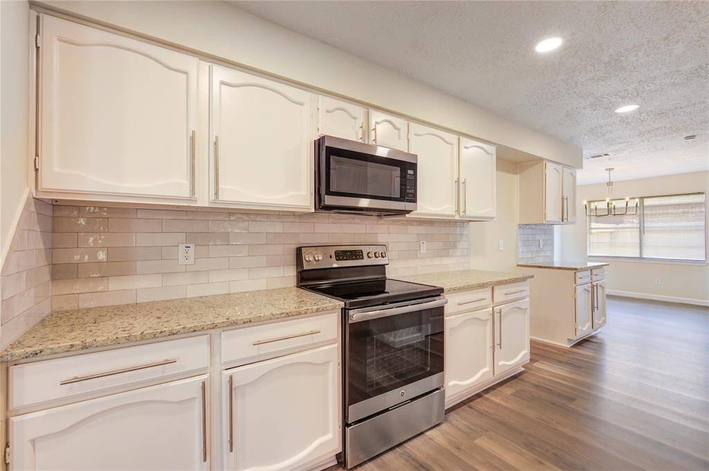 Plenty of cabinet space in this kitchen as well as a large pantry.