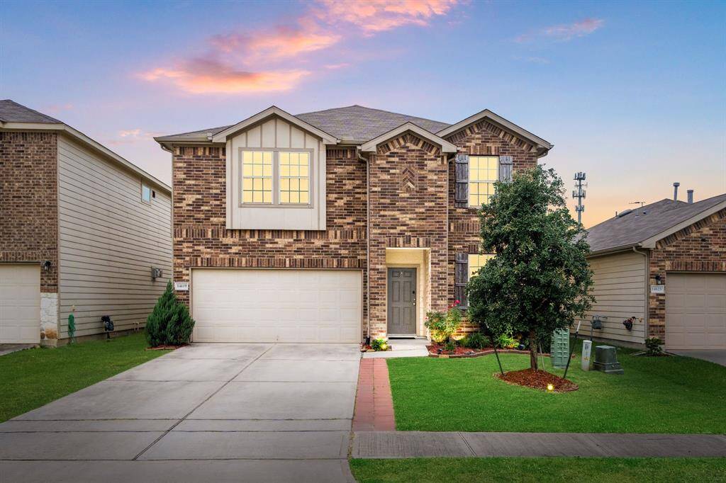 Stunning 2-story brick home featuring a double-car garage, covered entryway, and eye-catching curb appeal. Highlighted by large front-facing windows, crisp trim work, and manicured landscaping, this home offers a warm and welcoming presence.
