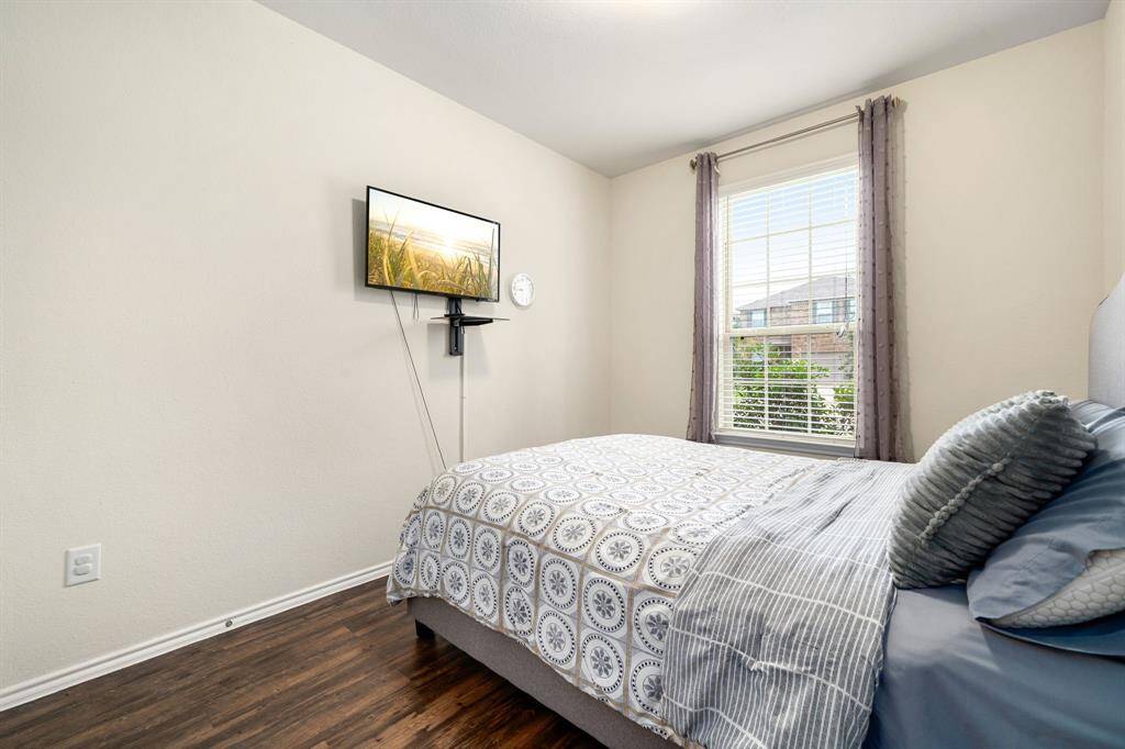secondary bedroom on 1st floor with access to full bath.