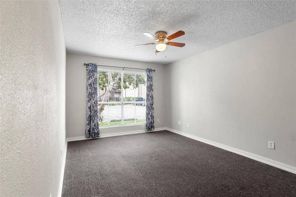 Spacious primary bedroom with great natural light.