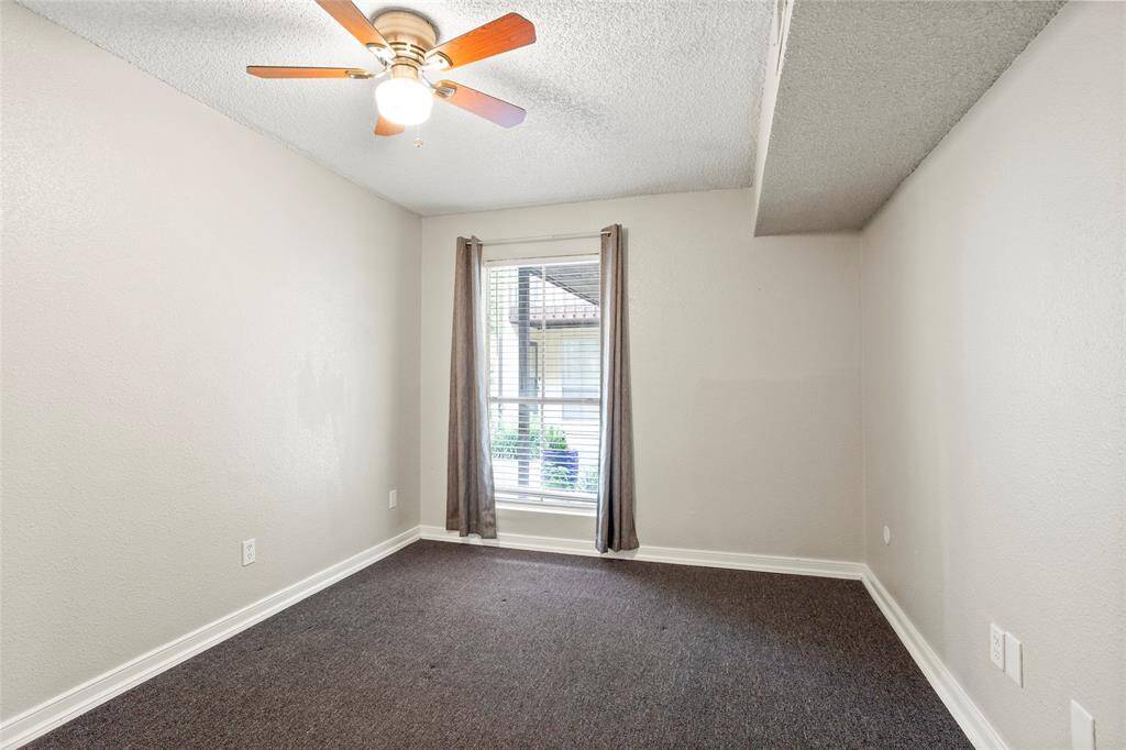 Second bedroom overlooks the front porch.